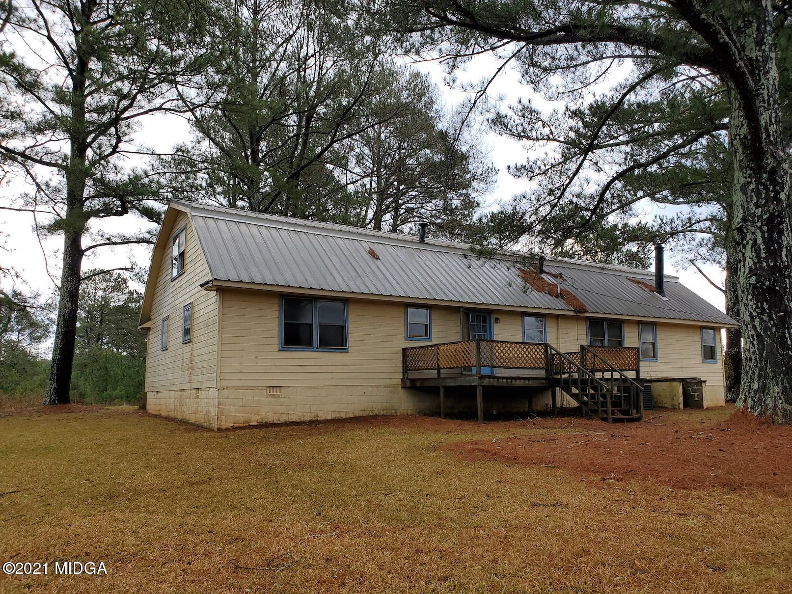 462 Thomas Ferry Road Jackson, GA 30233 - Photo 23 of 27 a front view of a house with a garden