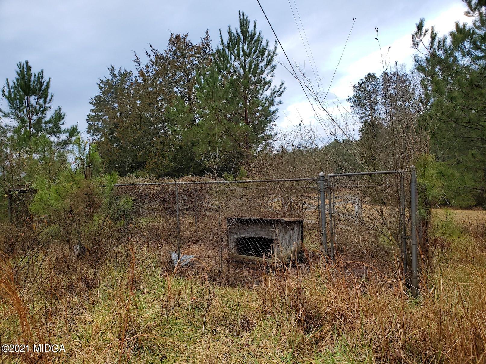 462 Thomas Ferry Road Jackson, GA 30233 - Photo 27 of 27 a backyard of a house with lots of green space