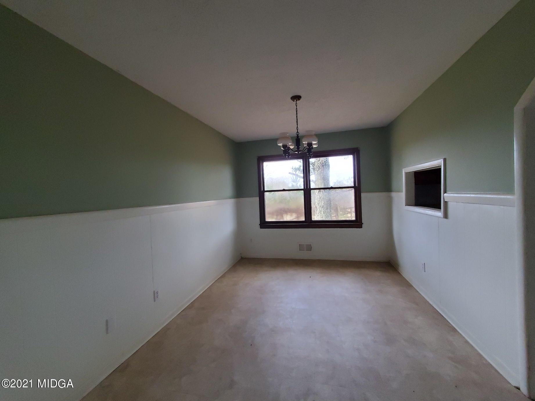 462 Thomas Ferry Road Jackson, GA 30233 - Photo 6 of 27 a view of an empty room with a window