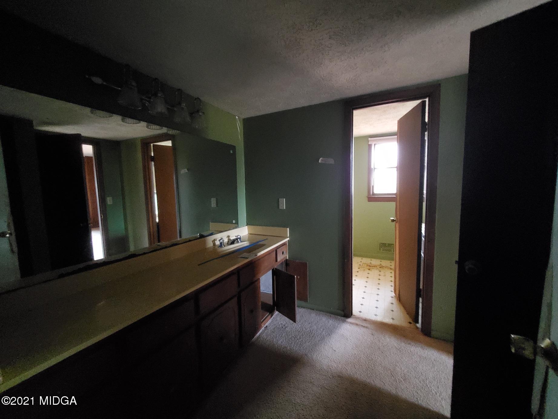 462 Thomas Ferry Road Jackson, GA 30233 - Photo 9 of 27 a bathroom with a sink and a mirror