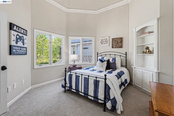 a bedroom with a bed and a table