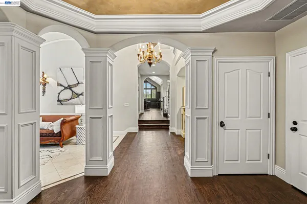a view of hallway with livingroom and furniture