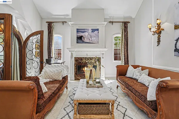 a living room with furniture and entry gate
