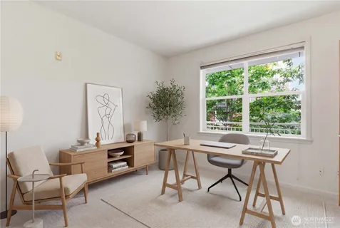 a workspace with furniture and a window