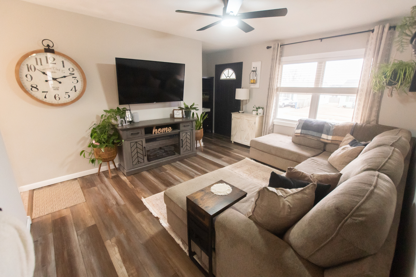 617 Orchard Street Dixon, IL 61021 - Photo 13 of 32 a living room with furniture a flat screen tv and a large window