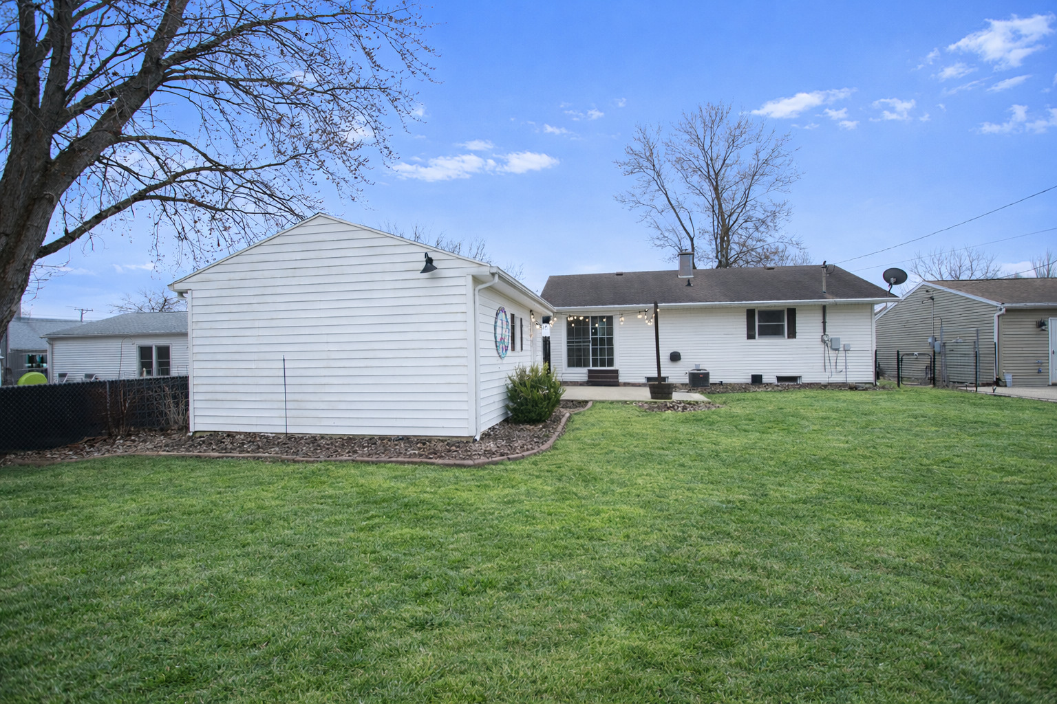 617 Orchard Street Dixon, IL 61021 - Photo 4 of 32 a front view of a house with a garden and yard