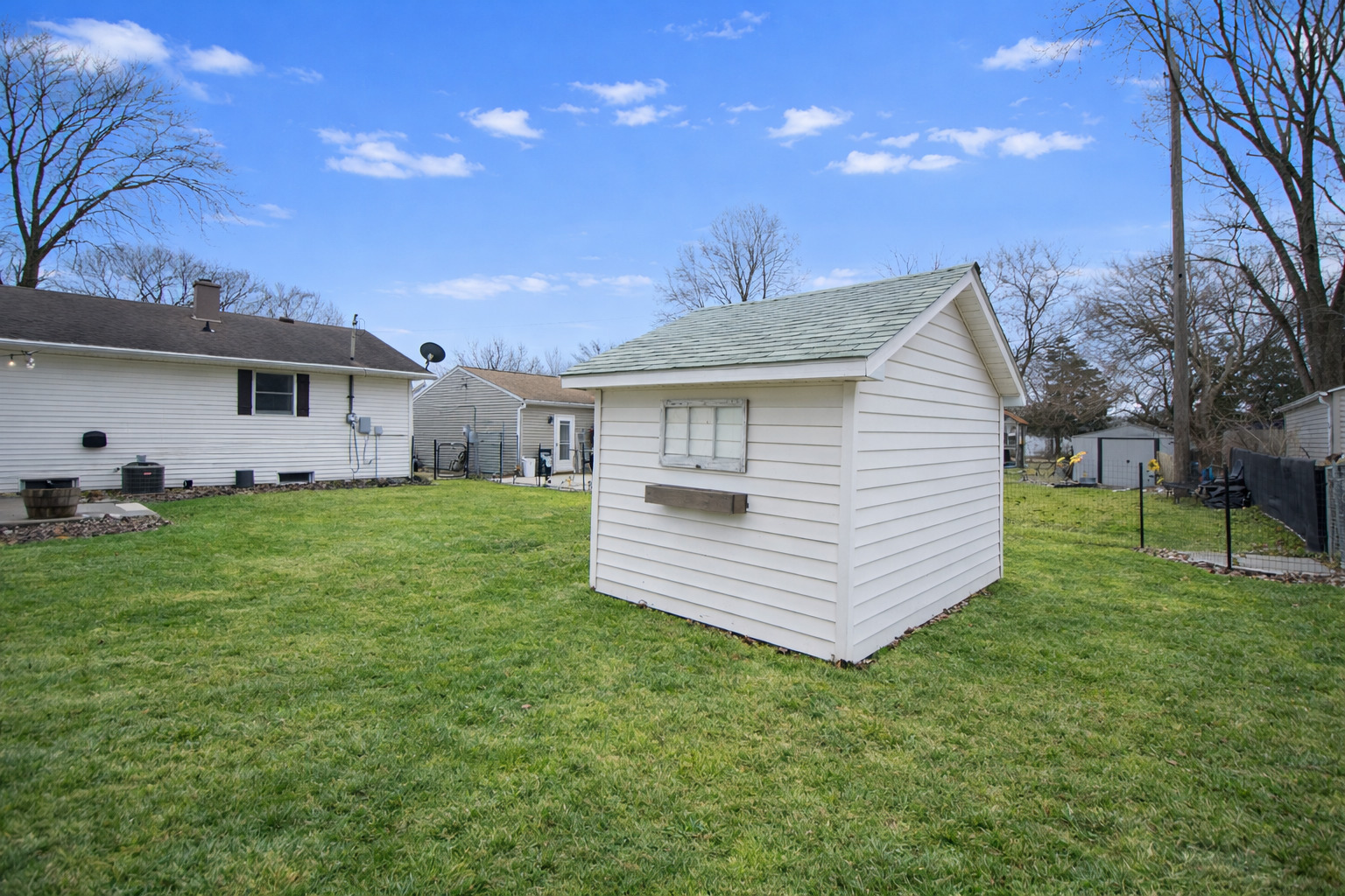 617 Orchard Street Dixon, IL 61021 - Photo 10 of 32 a front view of a house with a garden and yard