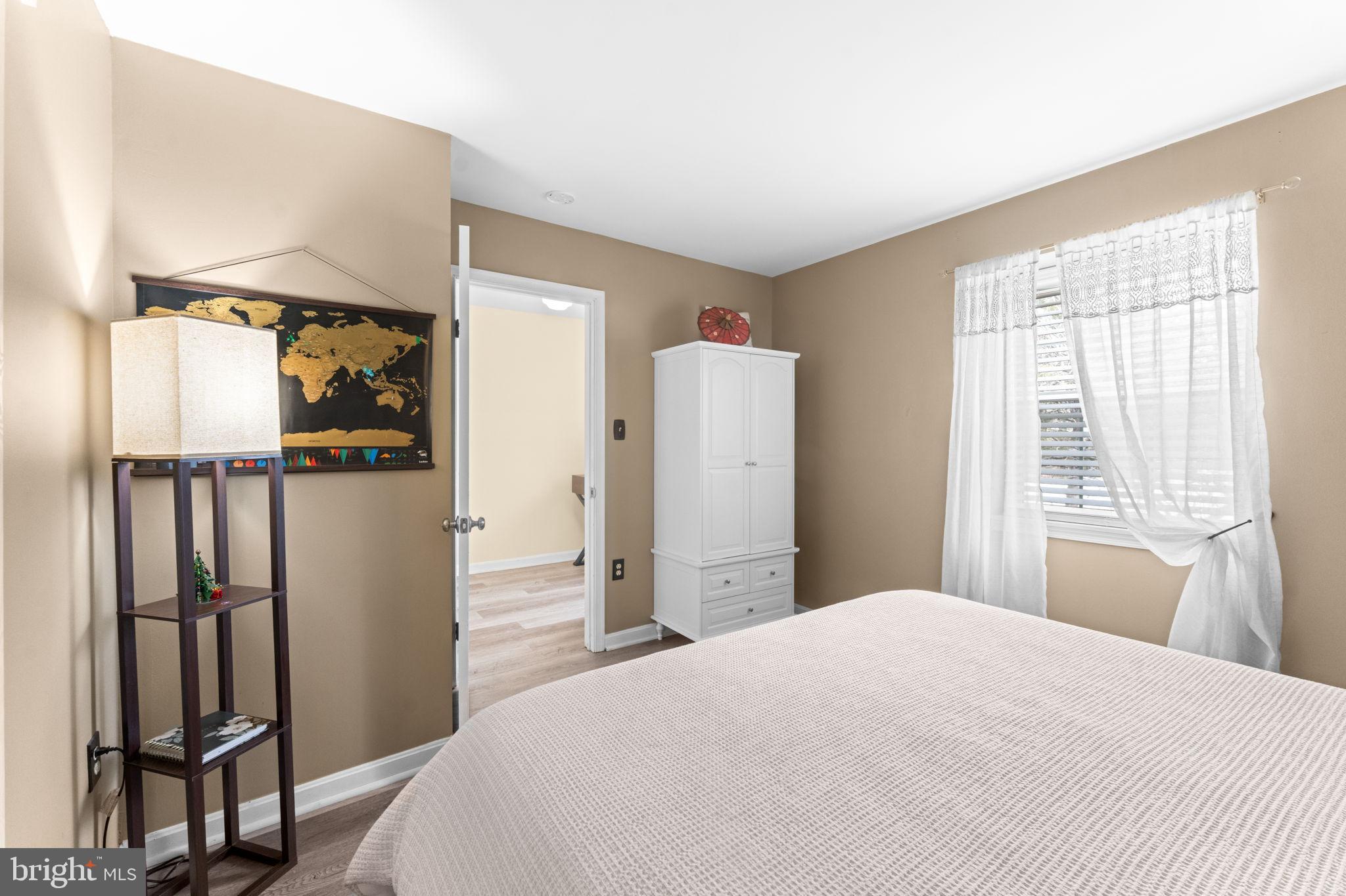 18310 Timko Lane, Unit 99 Germantown, MD 20874 - Photo 19 of 33 Cozy bedroom with warm, inviting tones.