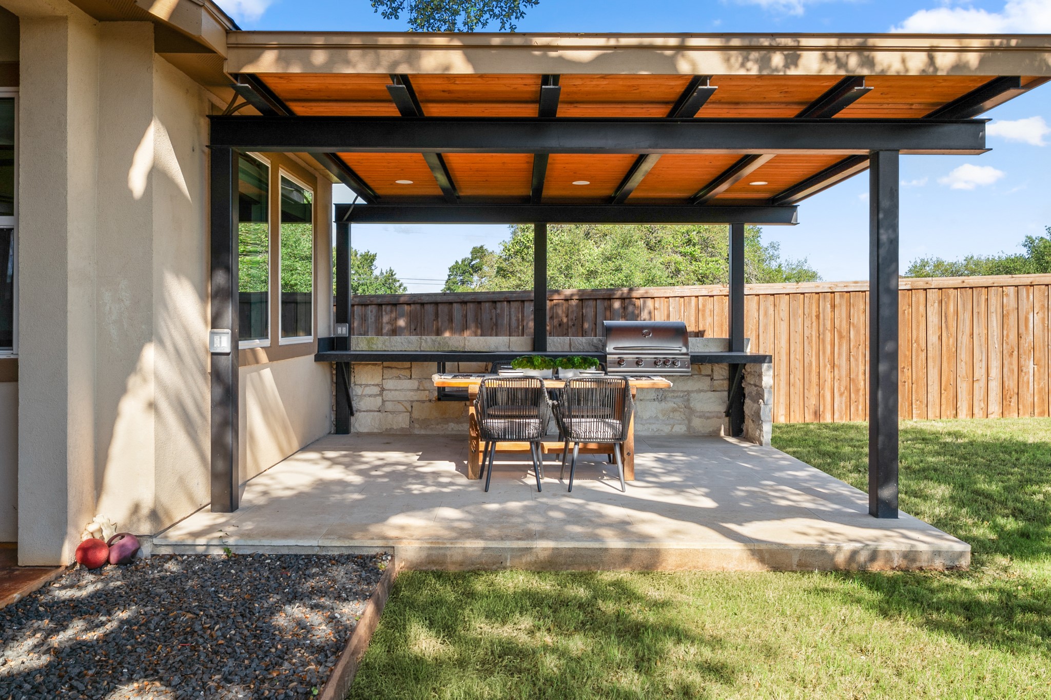 128 Hiram Cook Blanco, TX 78606 - Photo 28 of 40 Covered patio featuring an outdoor kitchen with built-in grill, stone base, and dark countertop