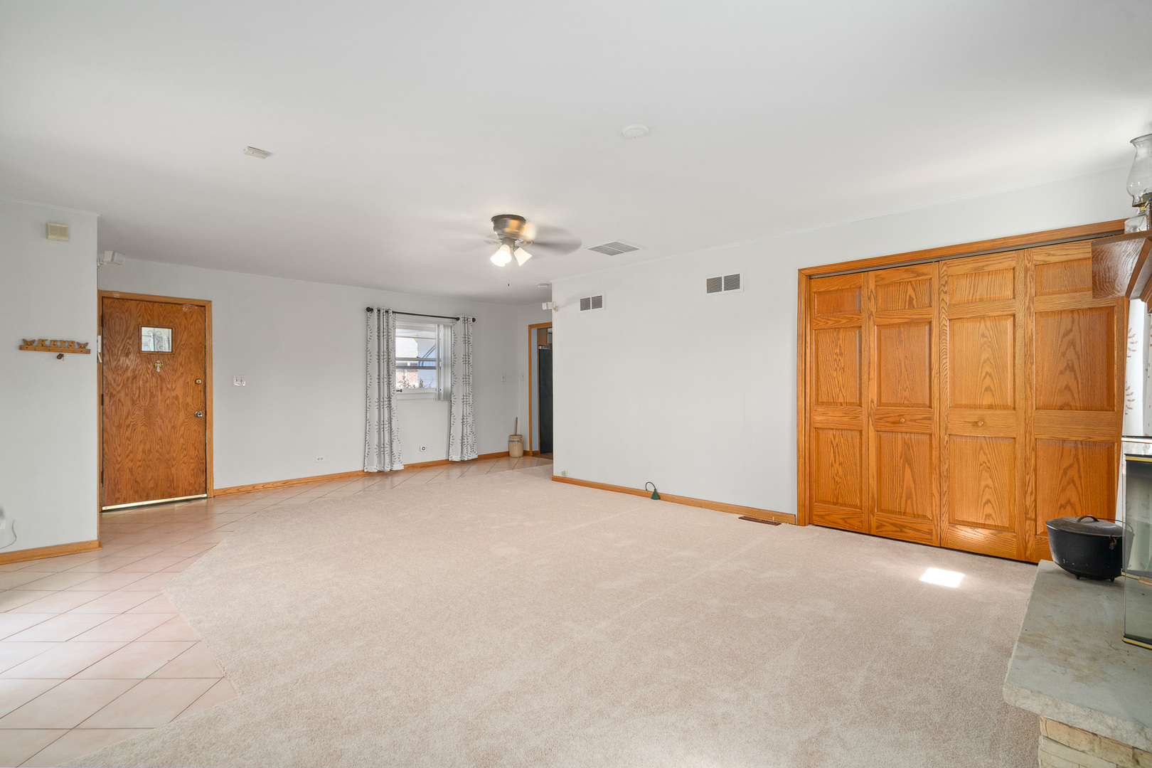 8008 Normandy Avenue Burbank, IL 60459 - Photo 13 of 41 a view of an empty room with a window