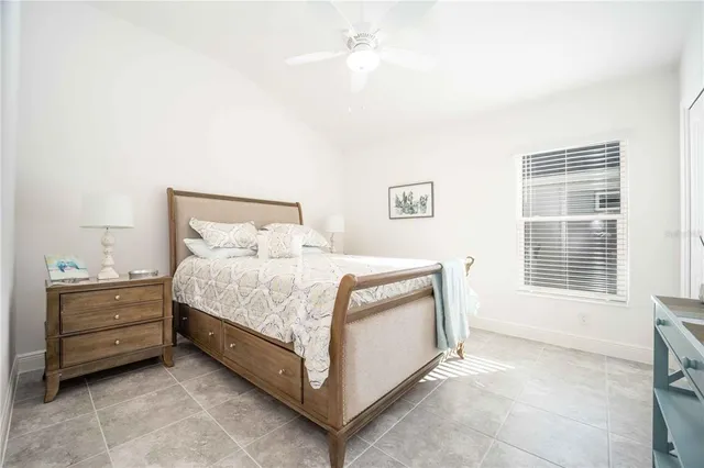 a bathroom with a sink a toilet a mirror and shower