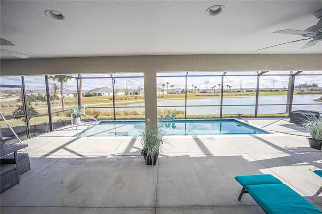 an aerial view of a house with a ocean view