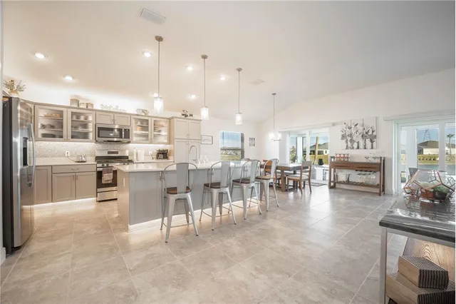 a large kitchen with a lot of counter space and appliances