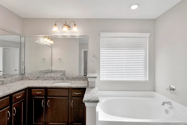 a bathroom with a sink and a bathtub