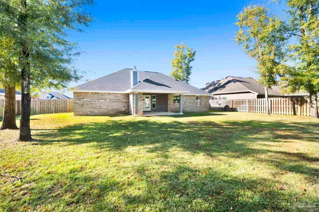 a house view with a swimming pool in front of it