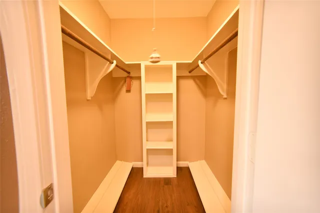 a bathroom with a sink a mirror and a shower