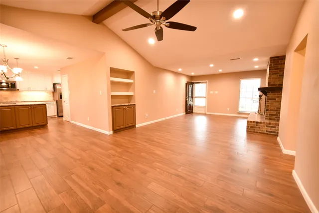 a view of a kitchen with a sink and a stove top oven