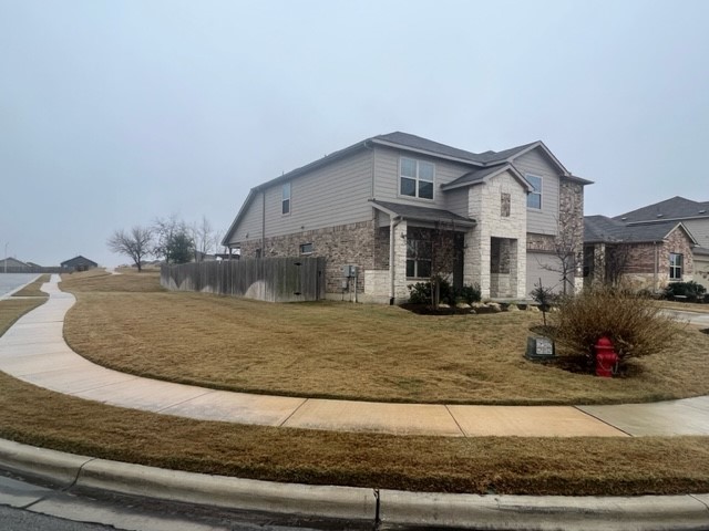 143 Tanzanite Circle Buda, TX 78610 - Photo 1 of 1 a house view with a outdoor space