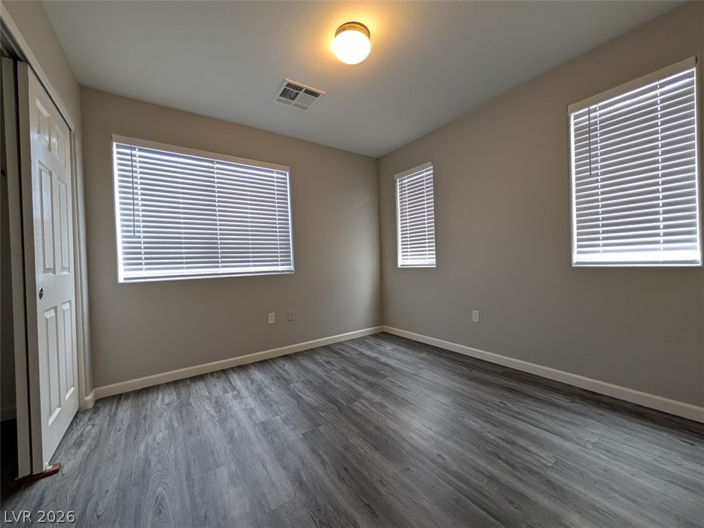 10308 Faustine Avenue Las Vegas, NV 89129 - Photo 26 of 28 Natural light filters through the blinds, illuminating the durable flooring in this versatile room.