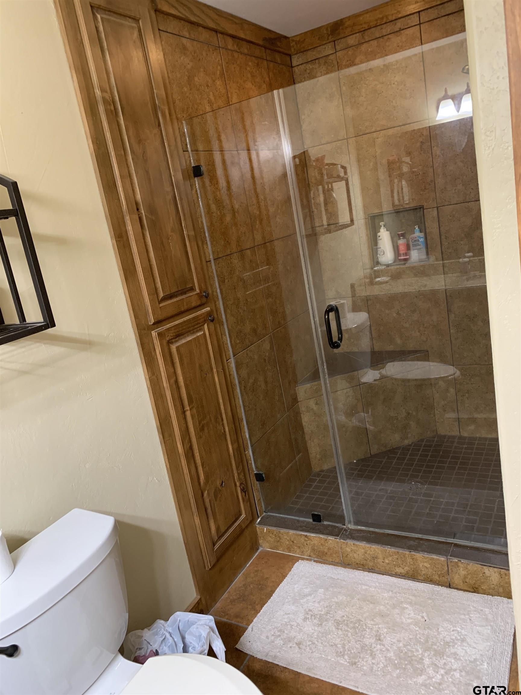 16650 C R 3419 Brownsboro, TX 75756 - Photo 11 of 36 a bathroom with a shower and toilet