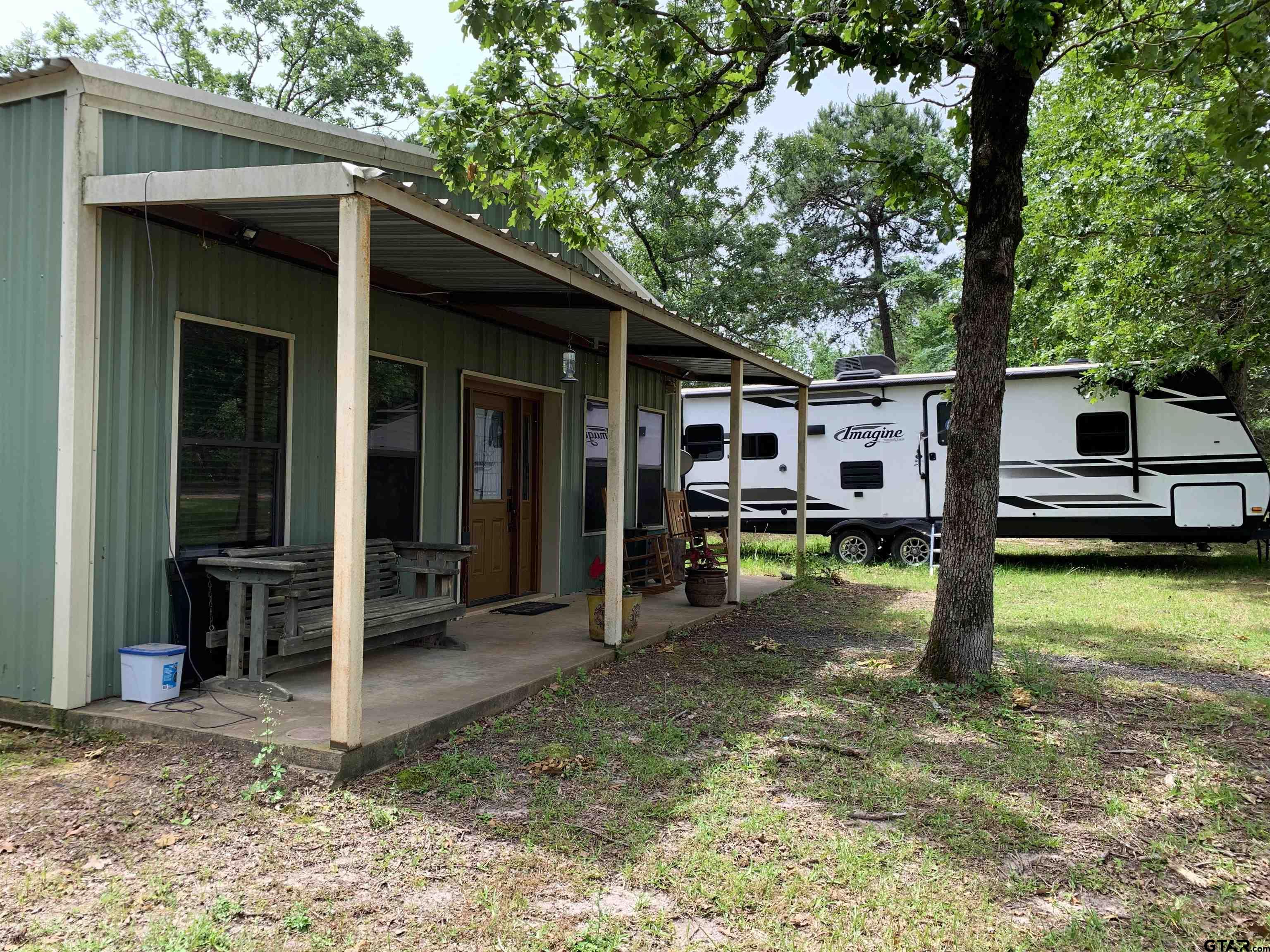 16650 C R 3419 Brownsboro, TX 75756 - Photo 23 of 36 a view of a house with a backyard porch and sitting area