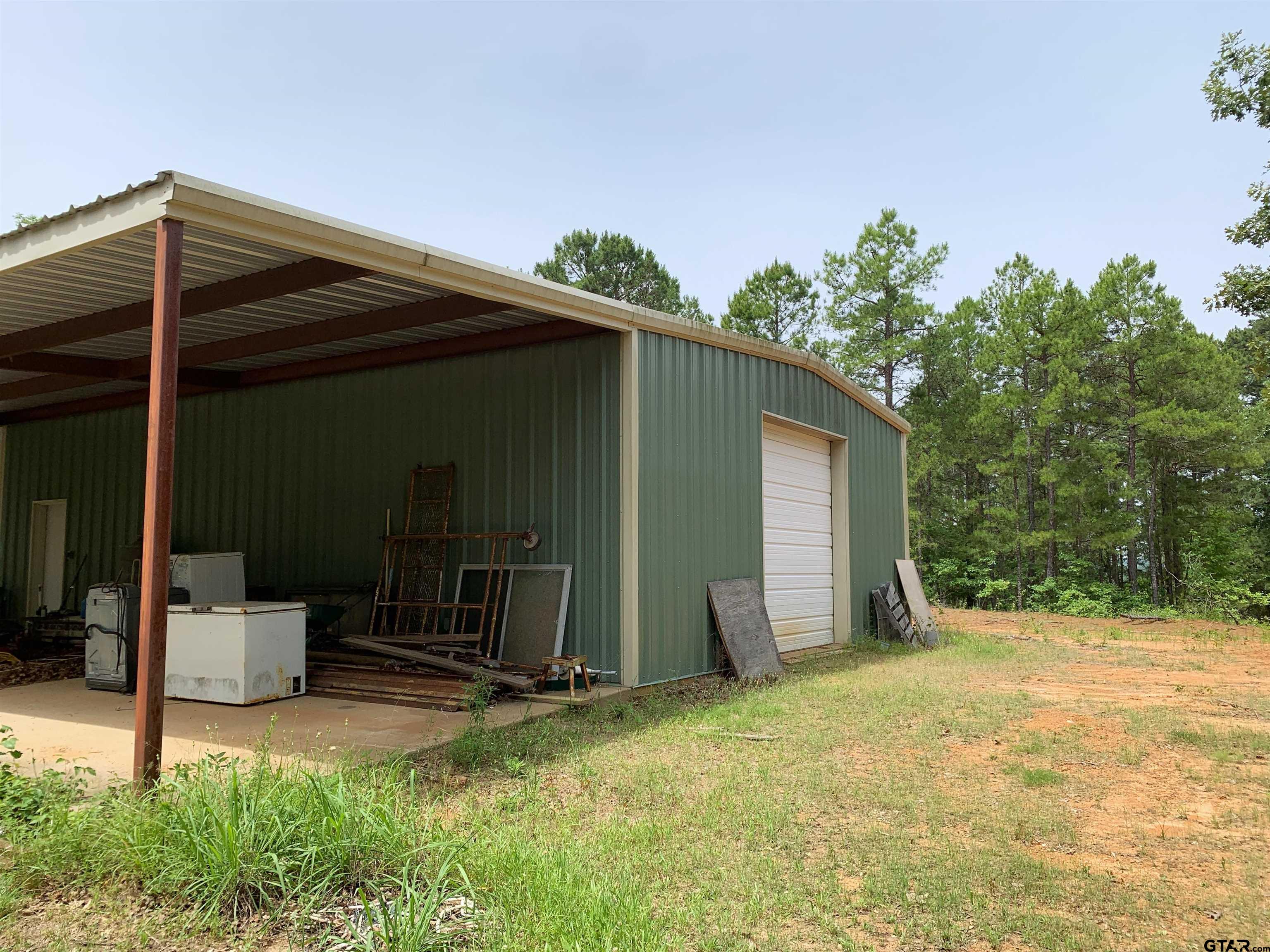 16650 C R 3419 Brownsboro, TX 75756 - Photo 25 of 36 a backyard of a house with shaded area