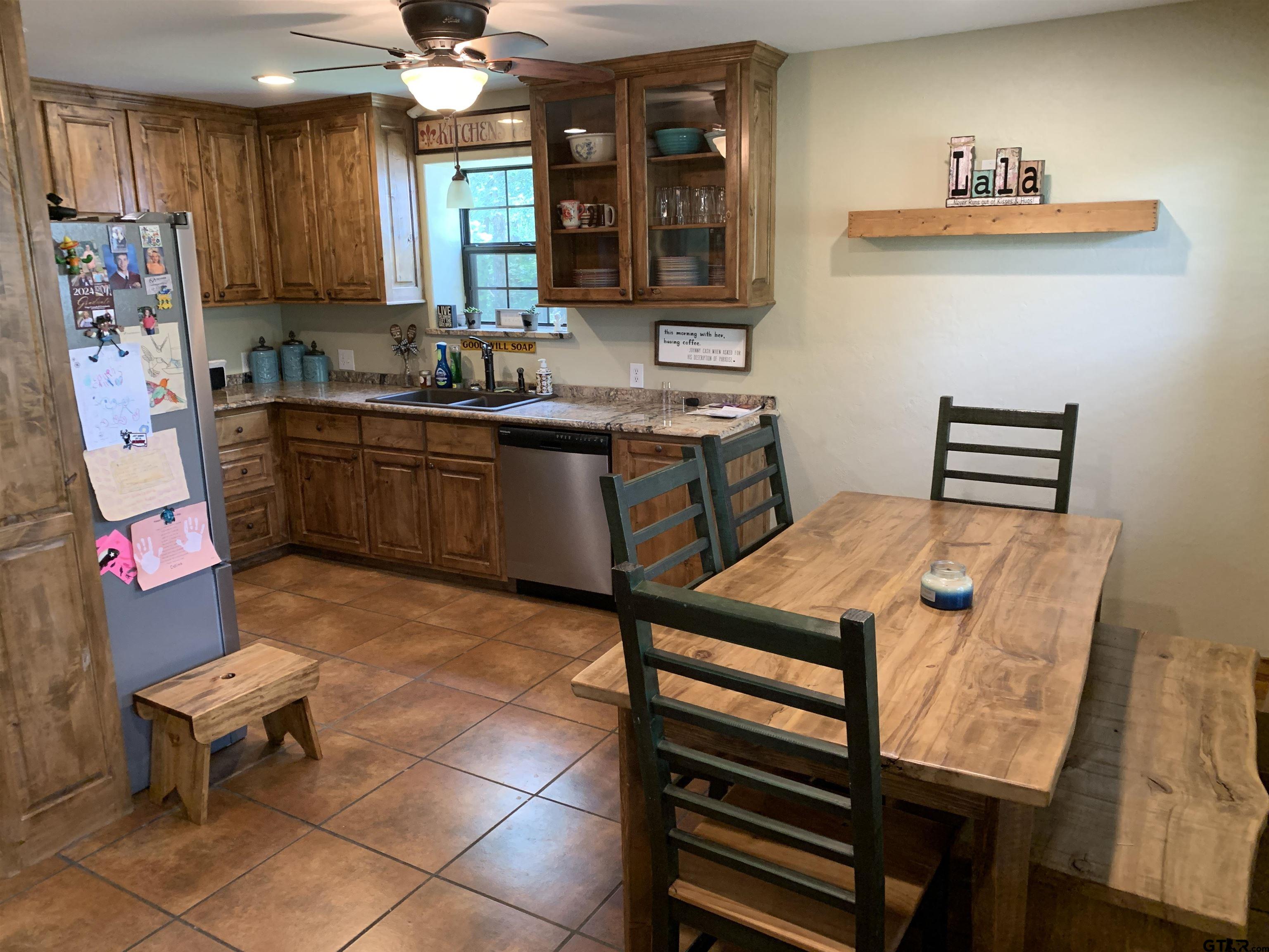 16650 C R 3419 Brownsboro, TX 75756 - Photo 7 of 36 a kitchen with stainless steel appliances kitchen island granite countertop a sink and a refrigerator