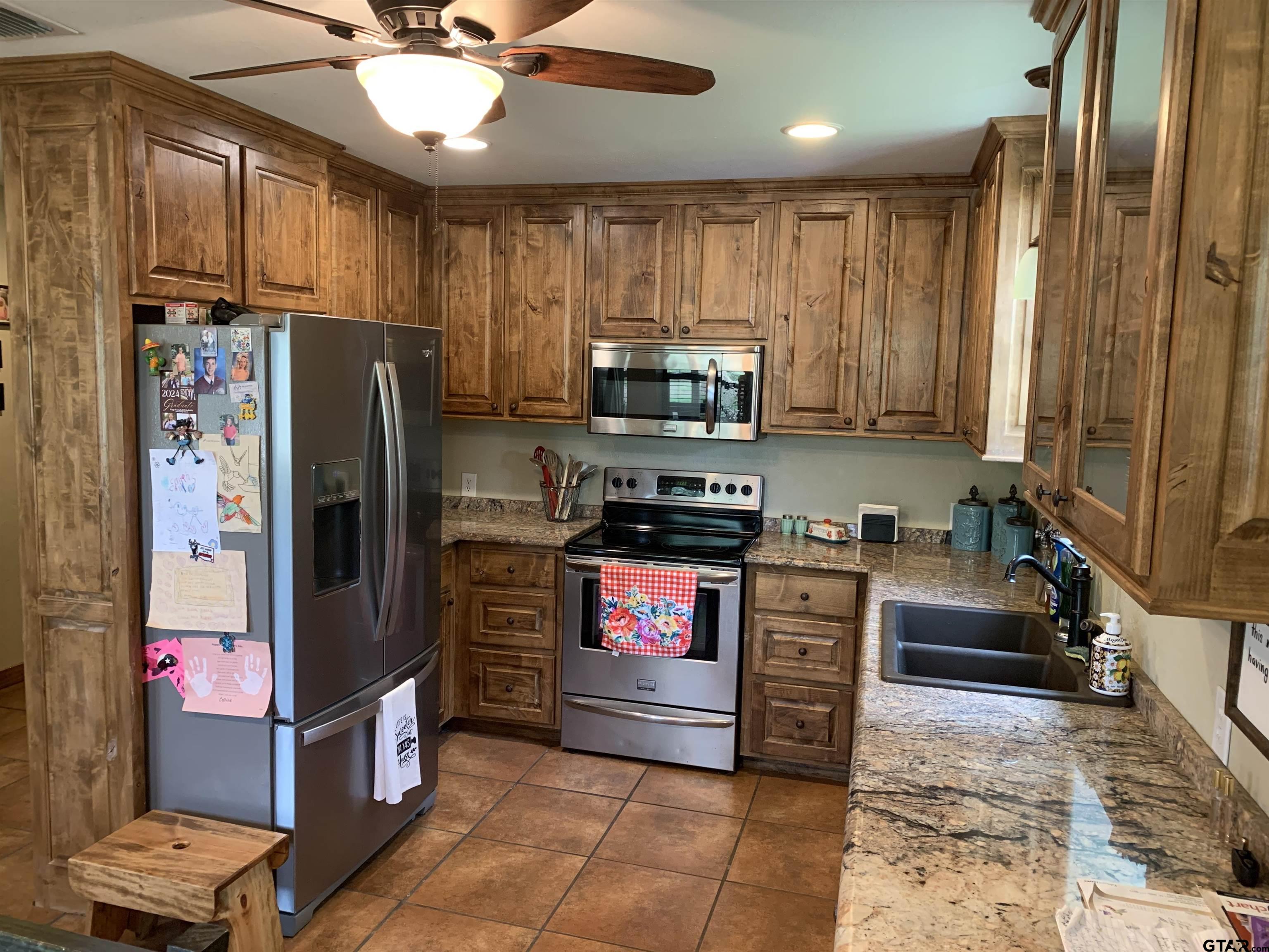 16650 C R 3419 Brownsboro, TX 75756 - Photo 8 of 36 a kitchen with stainless steel appliances granite countertop a refrigerator stove and sink