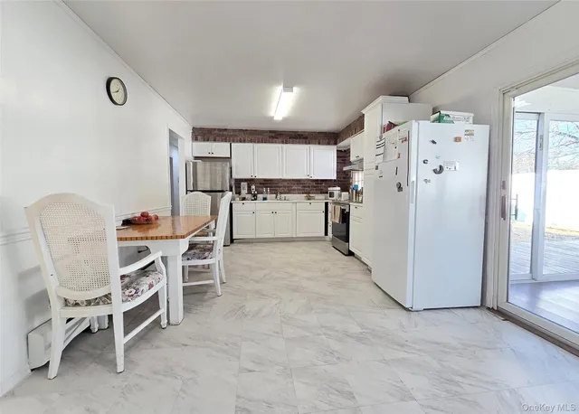 a living room with furniture window and wooden floor