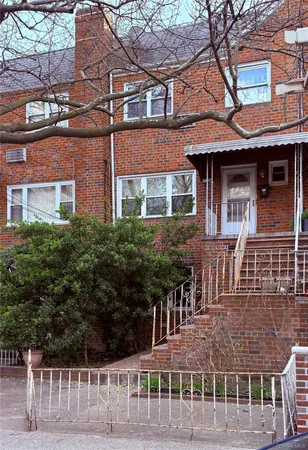 front view of a building with a small yard