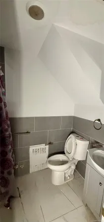 a bathroom with a toilet and a sink