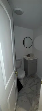 a bathroom with a sink toilet and tub