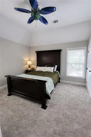 a bedroom with bed and window