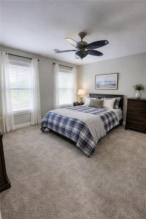 249 Serenity Loop Cataula, GA 31804 - Photo 14 of 16 a spacious bedroom with a bed and window