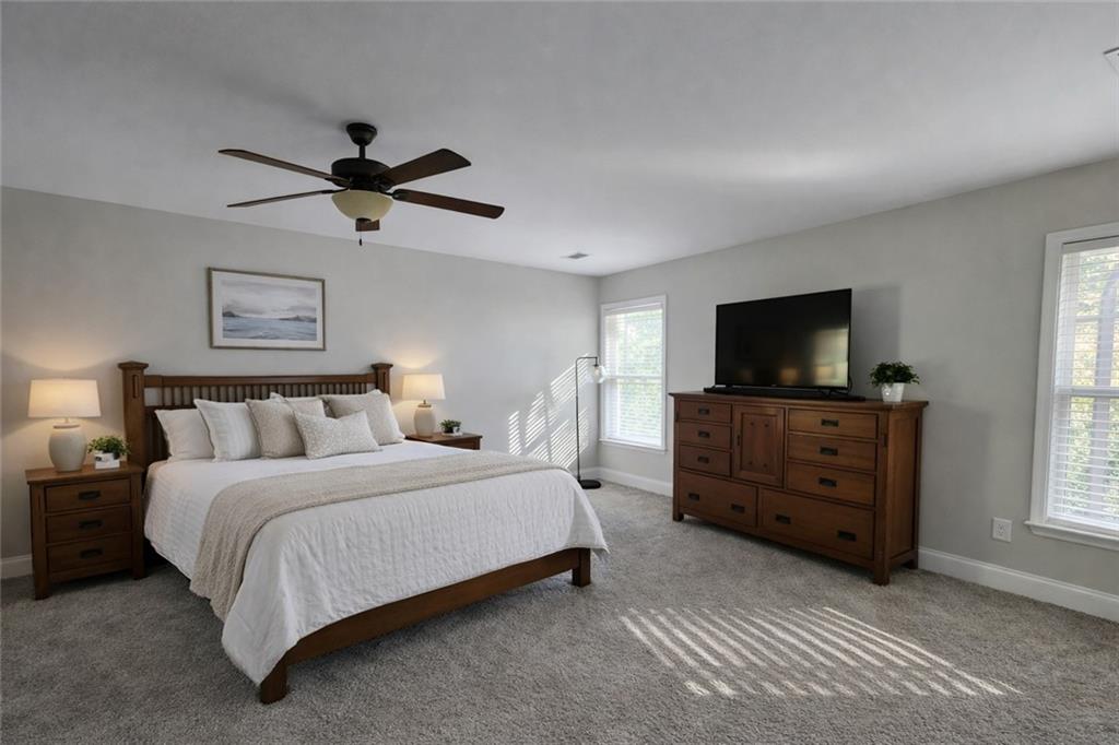 249 Serenity Loop Cataula, GA 31804 - Photo 16 of 16 a bedroom with a bed and a flat screen tv