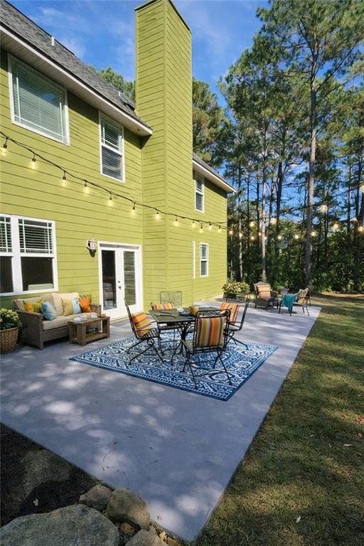 249 Serenity Loop Cataula, GA 31804 - Photo 2 of 16 a view of a house with backyard and sitting area