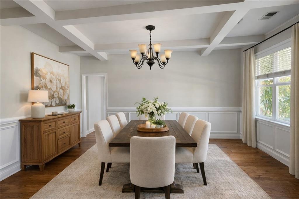 249 Serenity Loop Cataula, GA 31804 - Photo 5 of 16 a dining room with furniture a window and a chandelier