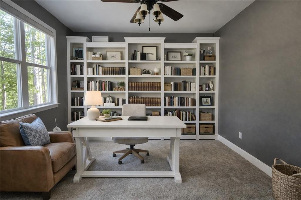 249 Serenity Loop Cataula, GA 31804 - Photo 6 of 16 a living room with furniture and a book shelf