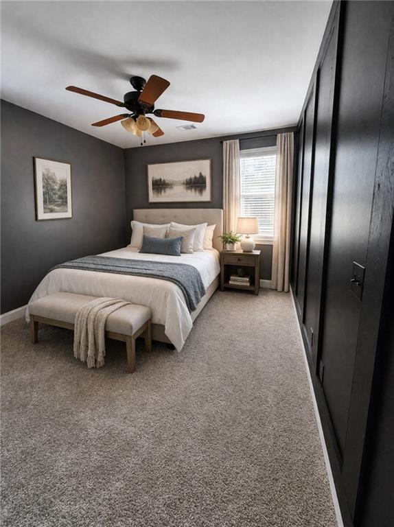 249 Serenity Loop Cataula, GA 31804 - Photo 7 of 16 a bedroom with a bed couch and a large window