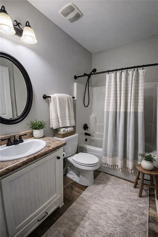 249 Serenity Loop Cataula, GA 31804 - Photo 8 of 16 a bathroom with a granite countertop toilet sink and mirror