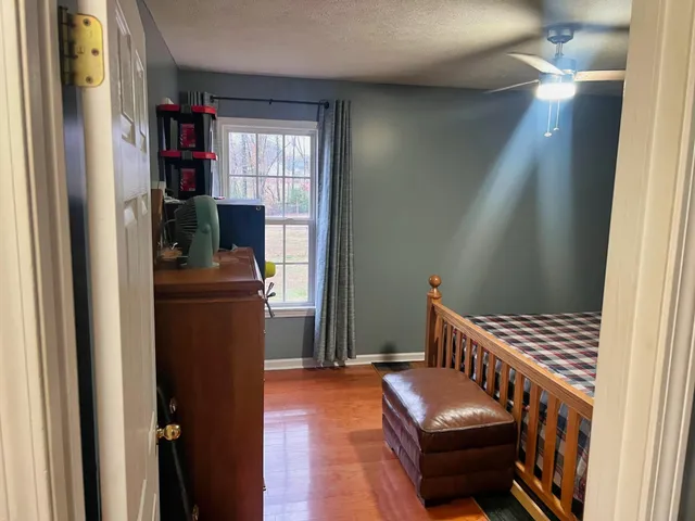 a bathroom with a toilet and shower curtain