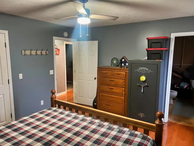 a bed room with a bed and a window