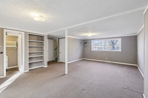 a bathroom with a sink toilet and mirror
