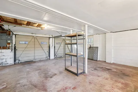 a view of house with outdoor space and garden