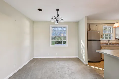 a view of a kitchen with a sink and cabinet area
