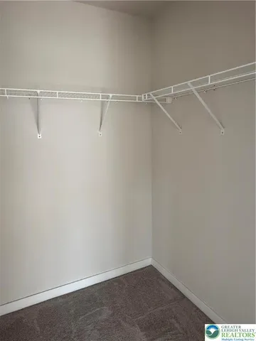 a view of an empty walk in closet