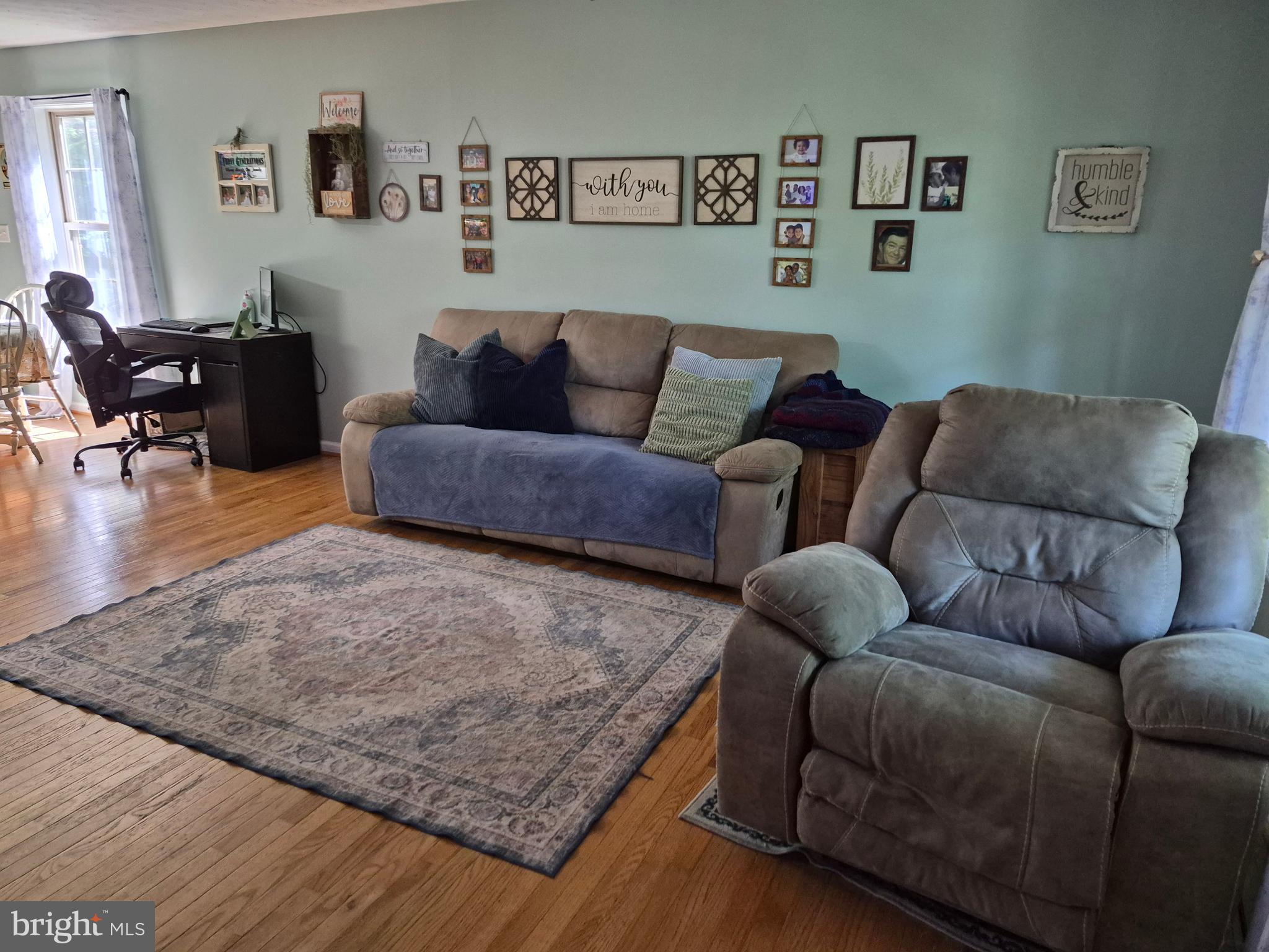 1440 Drummer Hill Road Front Royal, VA 22630 - Photo 28 of 42 a living room with furniture and wooden floor