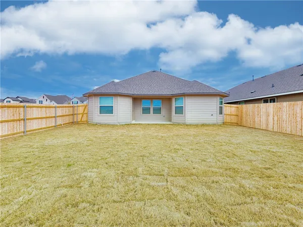 a house with yard in front of it