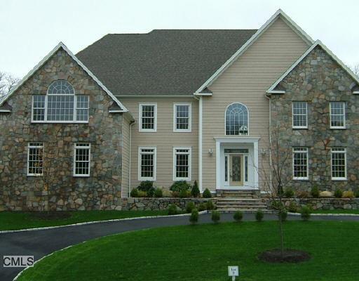 9 Settlers Ridge Road Trumbull, CT 06611 - Photo 1 of 1 a front view of a house with a yard and porch