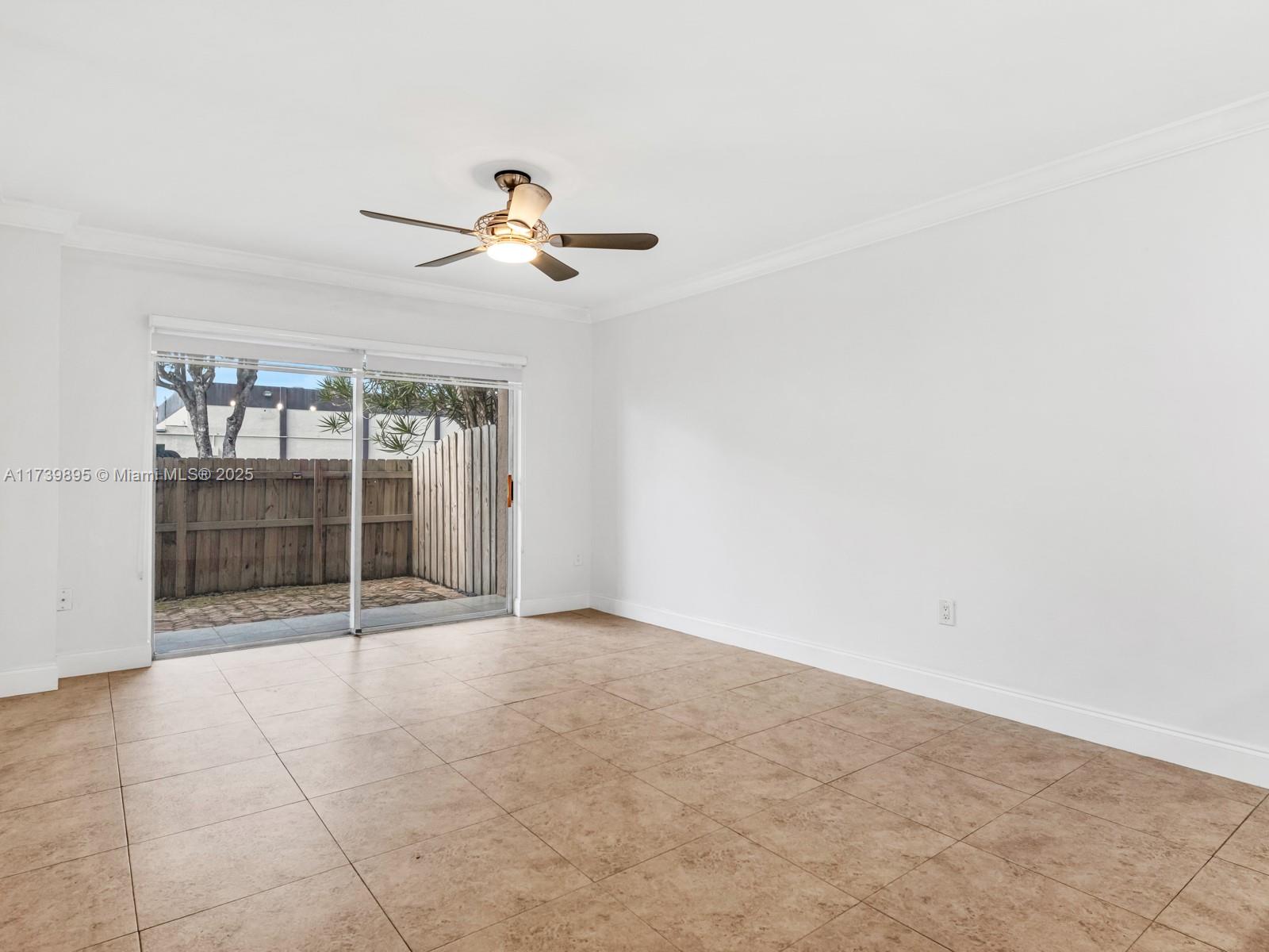 10900 Southwest 104th Street, Unit 114 Miami, FL 33176 - Photo 24 of 31 a view of an empty room with a window